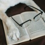 A dog doing some research and reading